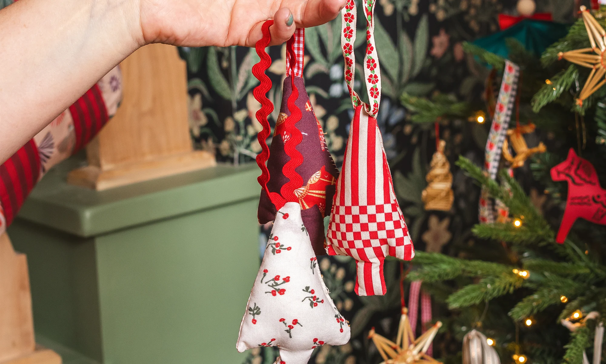 Brittany Jepson holding handmade Christmas ornaments.