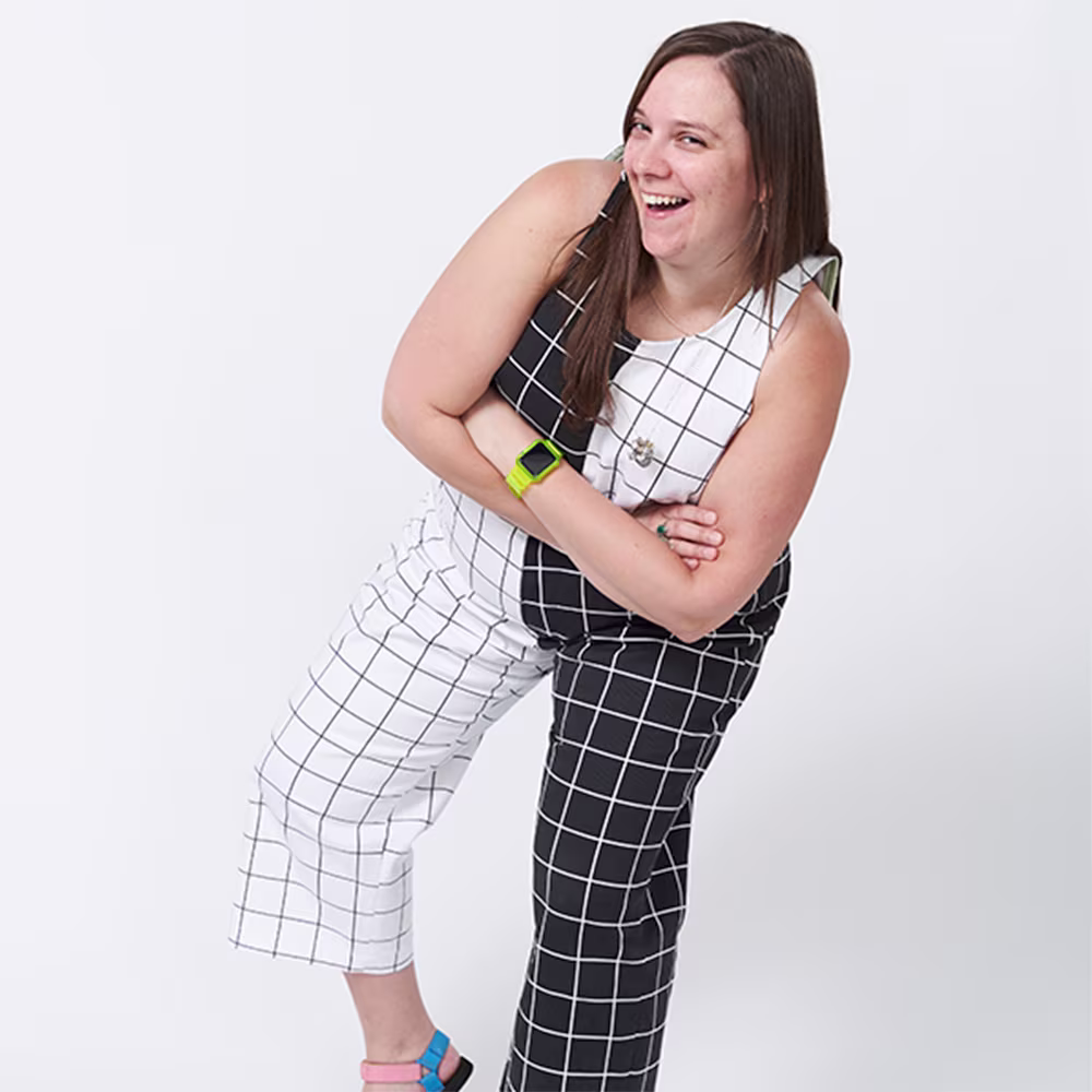 Spoonflower employee Sarah B wearing black and white grid pattern denim pants and top.