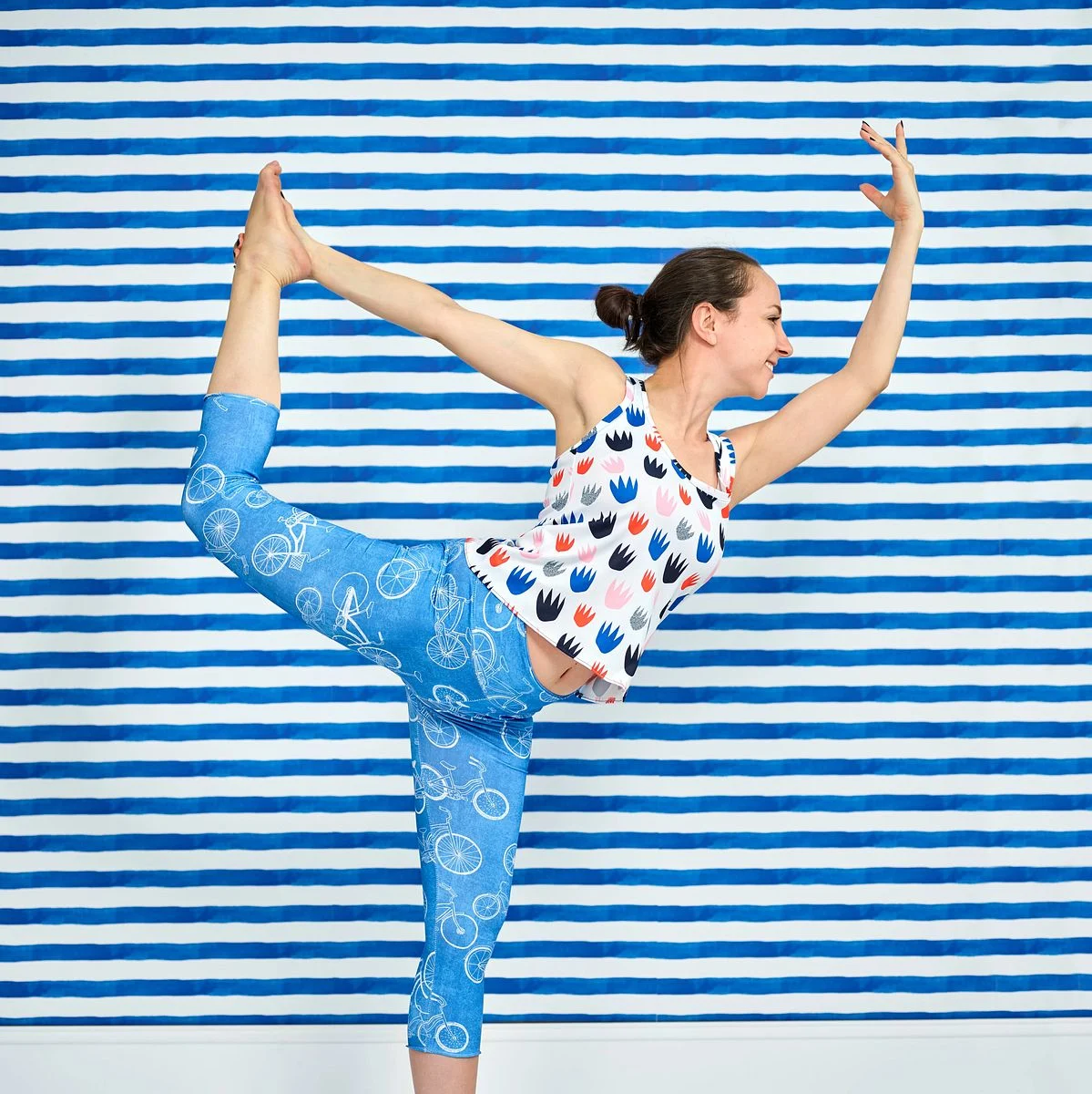 A model stretches in an outfit made with Sport Pique