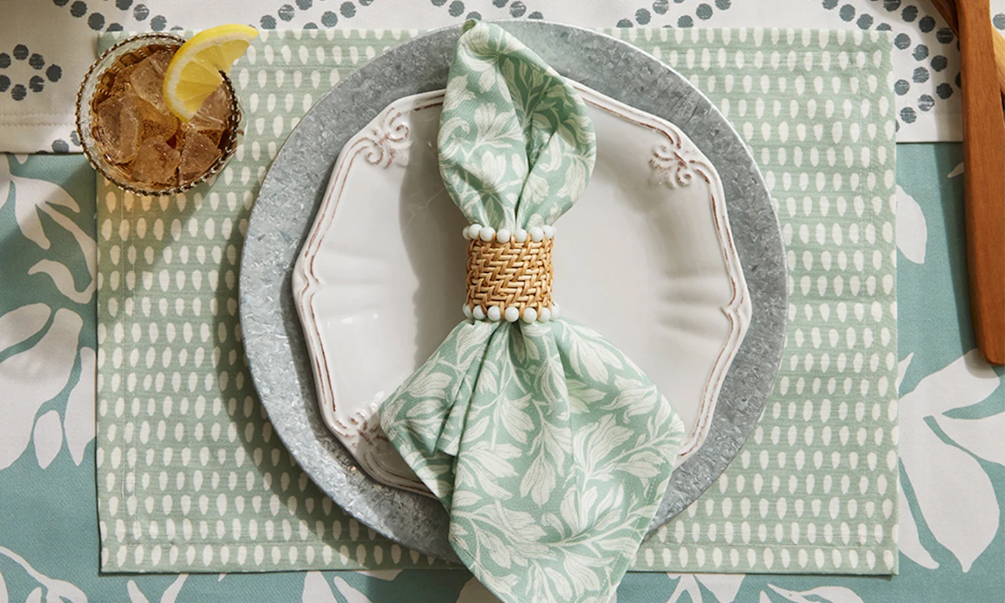 dining place setting with a mint green napkin and placemat.
