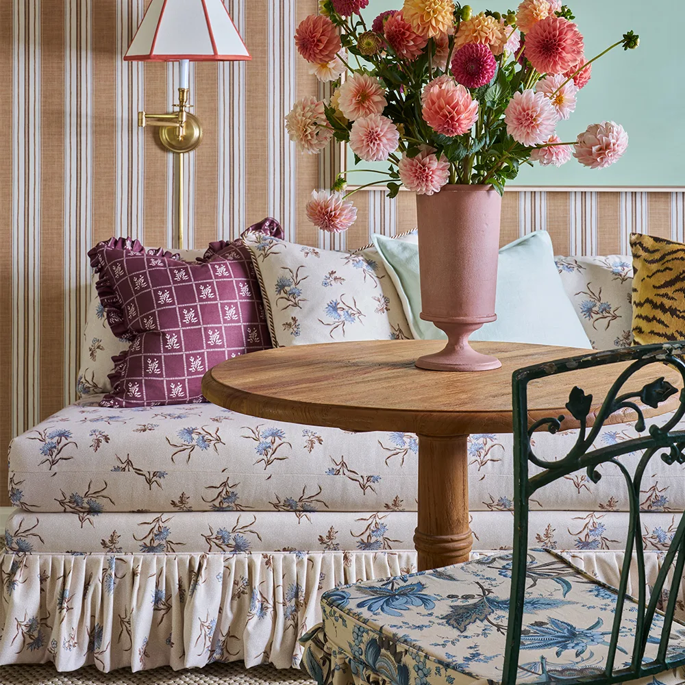 Couch upholstered in Edwina Floral Toss design fabric.