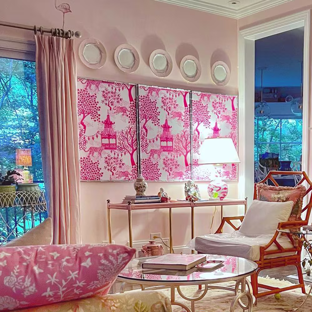Living space with art made of pink peel and stick wallpaper.