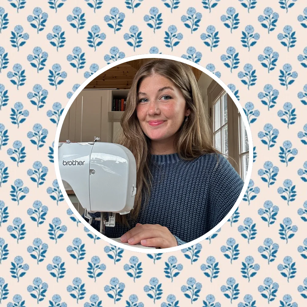 Headshot of Sydney Graham at her sewing machine