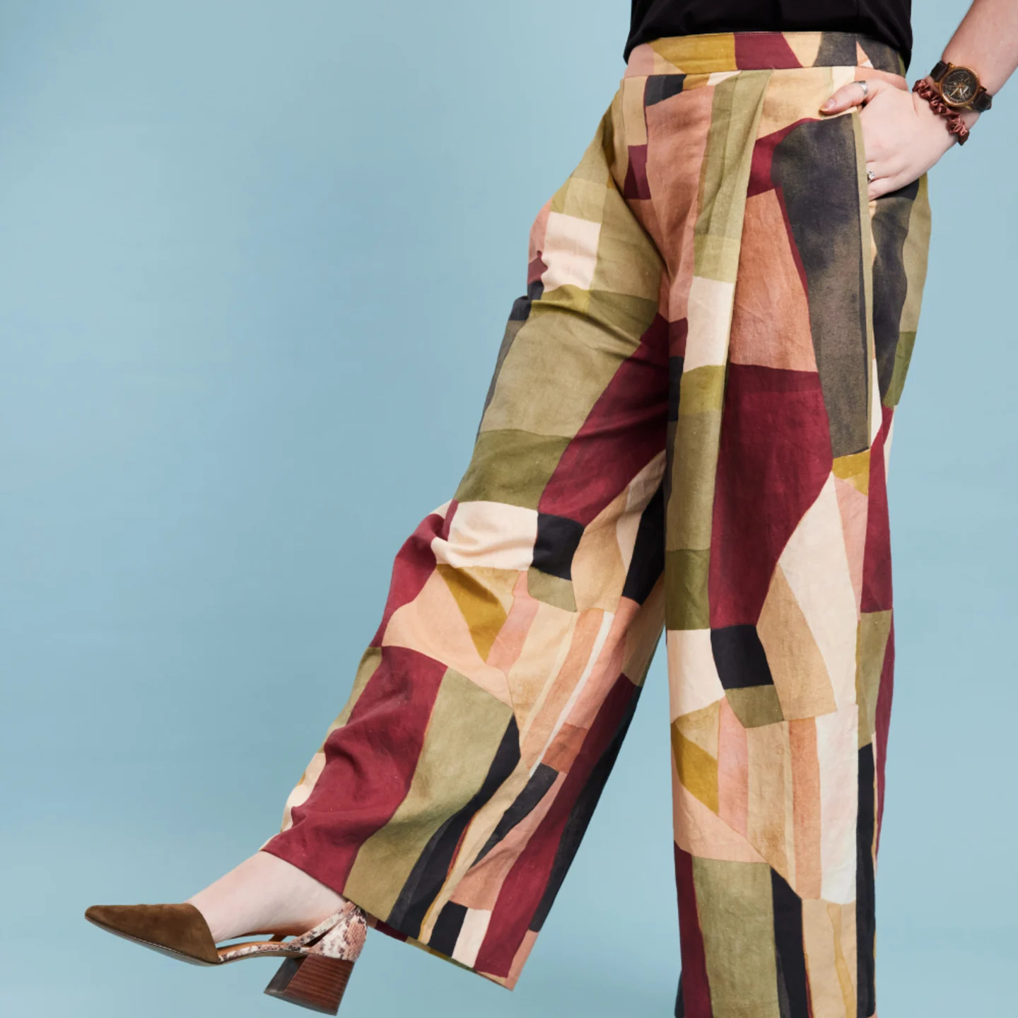 Woman wearing trousers with abstract geometric print