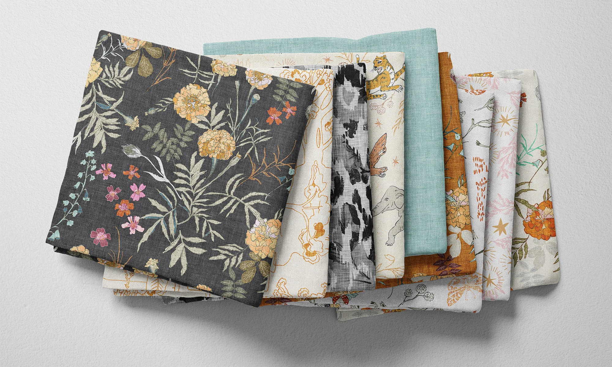 A selection of folded fabric fat quarters