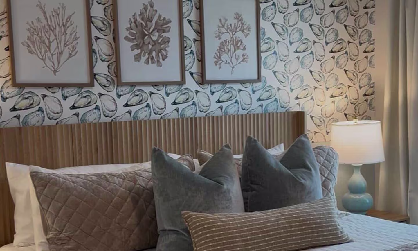 Bedroom with oyster wallpaper.
