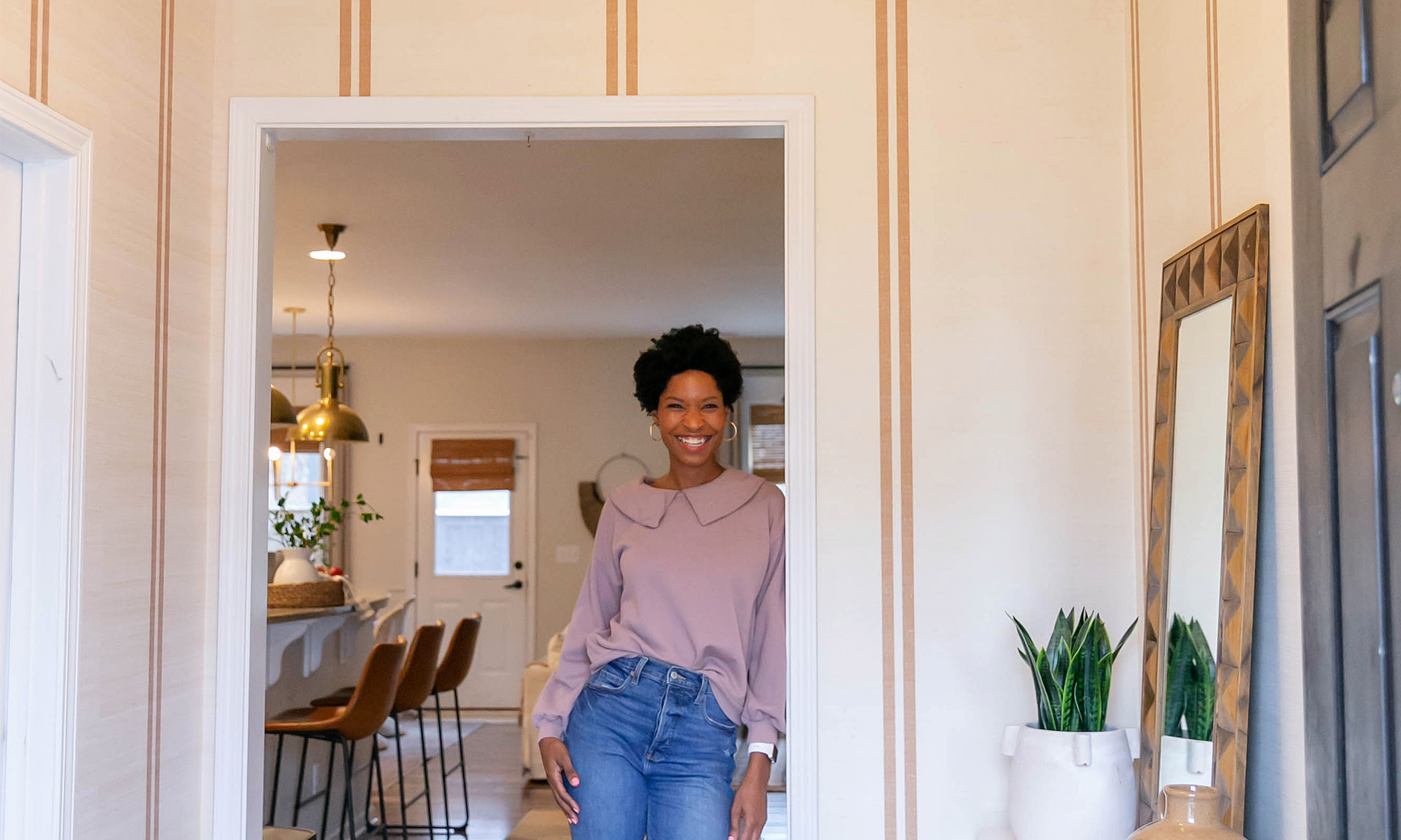 Tiffany of the Prettyreal blog in her entryway redone with grasscloth wallpaper.