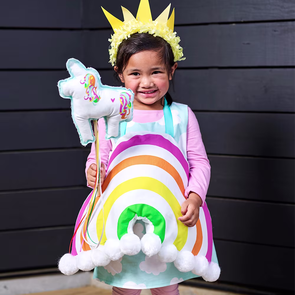 Little girl in a rainbow costume.