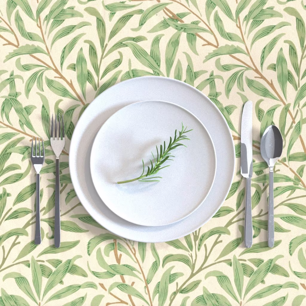 Tablecloth with a William Morris Willow Bough design and a place setting.