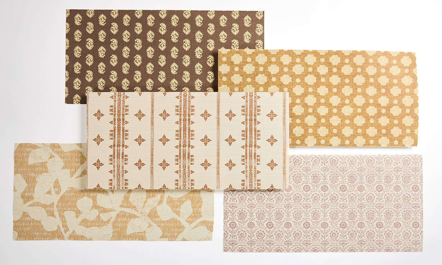 A wallpaper laydown of brown and tan rustic style designs.
