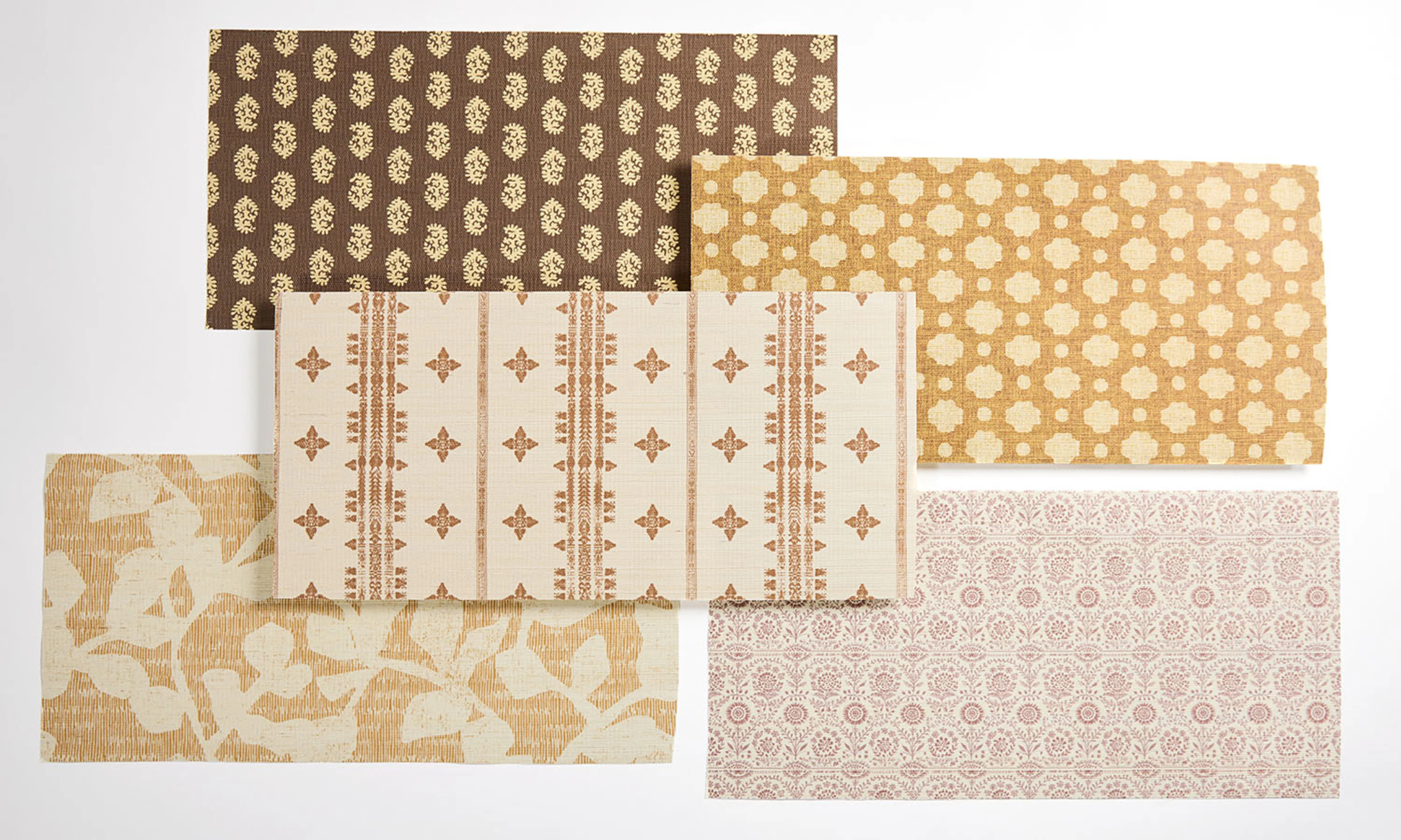 A wallpaper laydown of brown and tan rustic style designs.