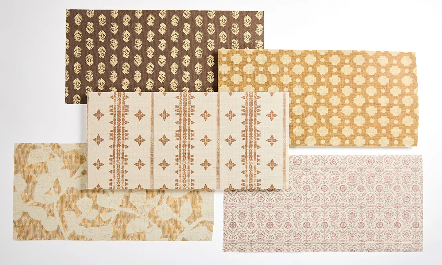 A wallpaper laydown of brown and tan rustic style designs.