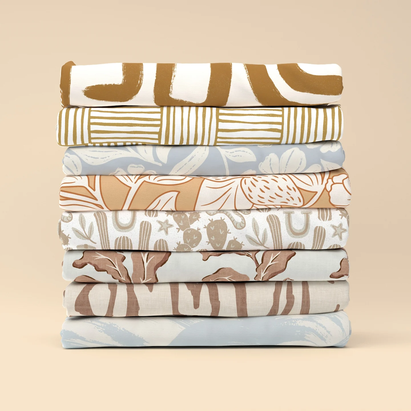 A folded stack of printed neutral fabric