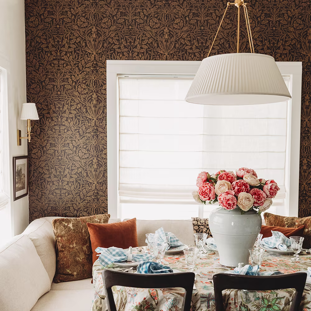 Brown morris inspired wallpaper in a dining nook.