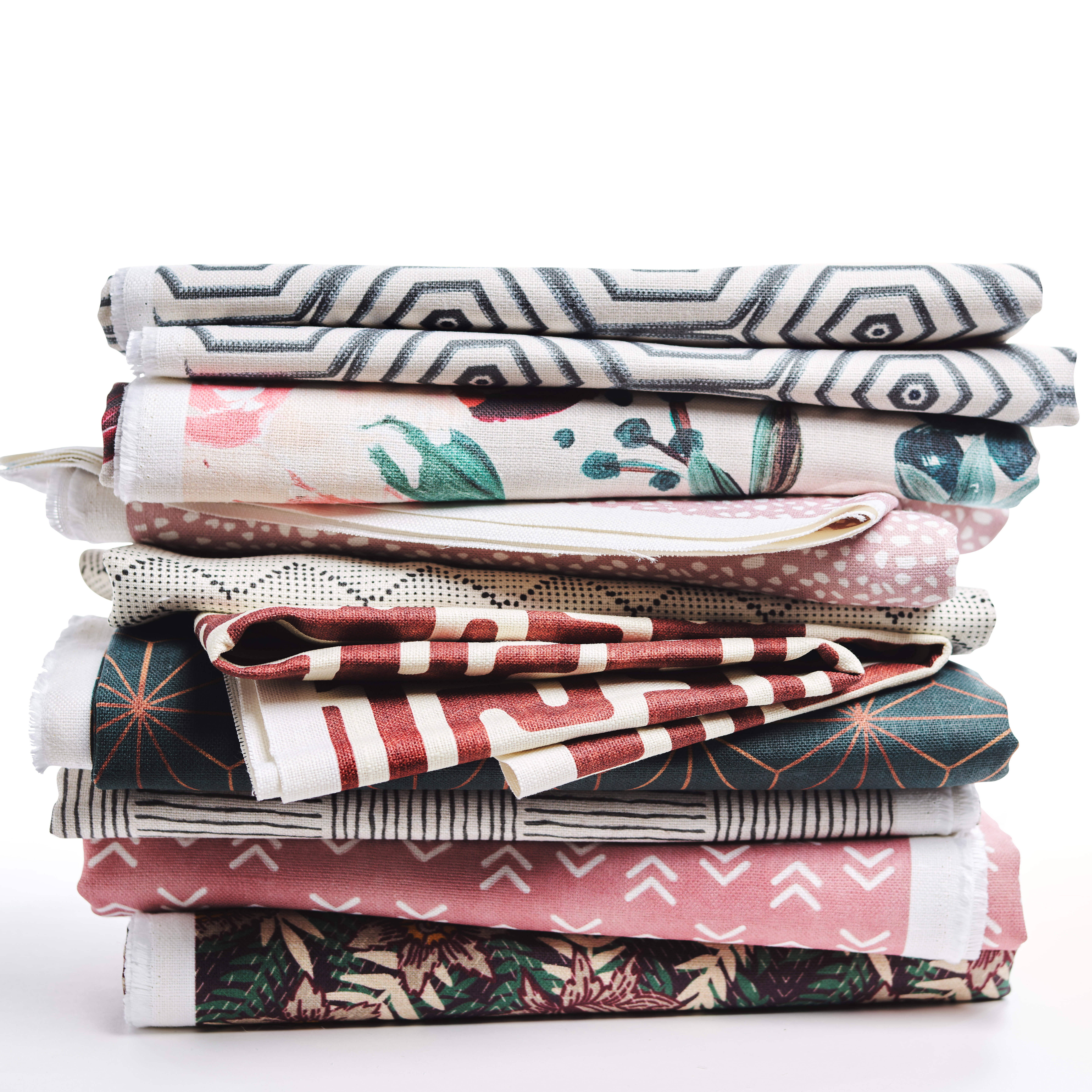 Stack of colorfully printed upholstery fabric