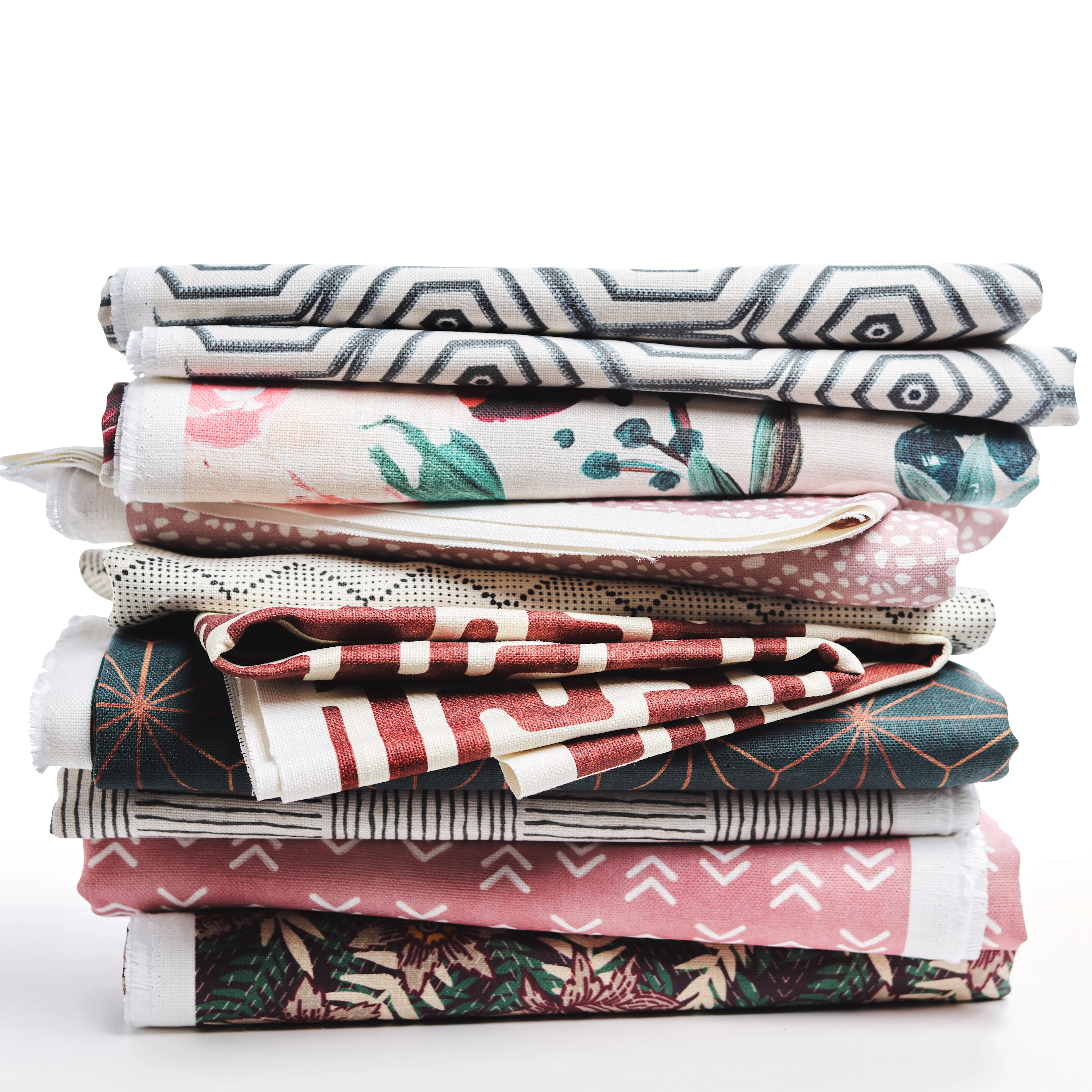 Stack of colorfully printed upholstery fabric