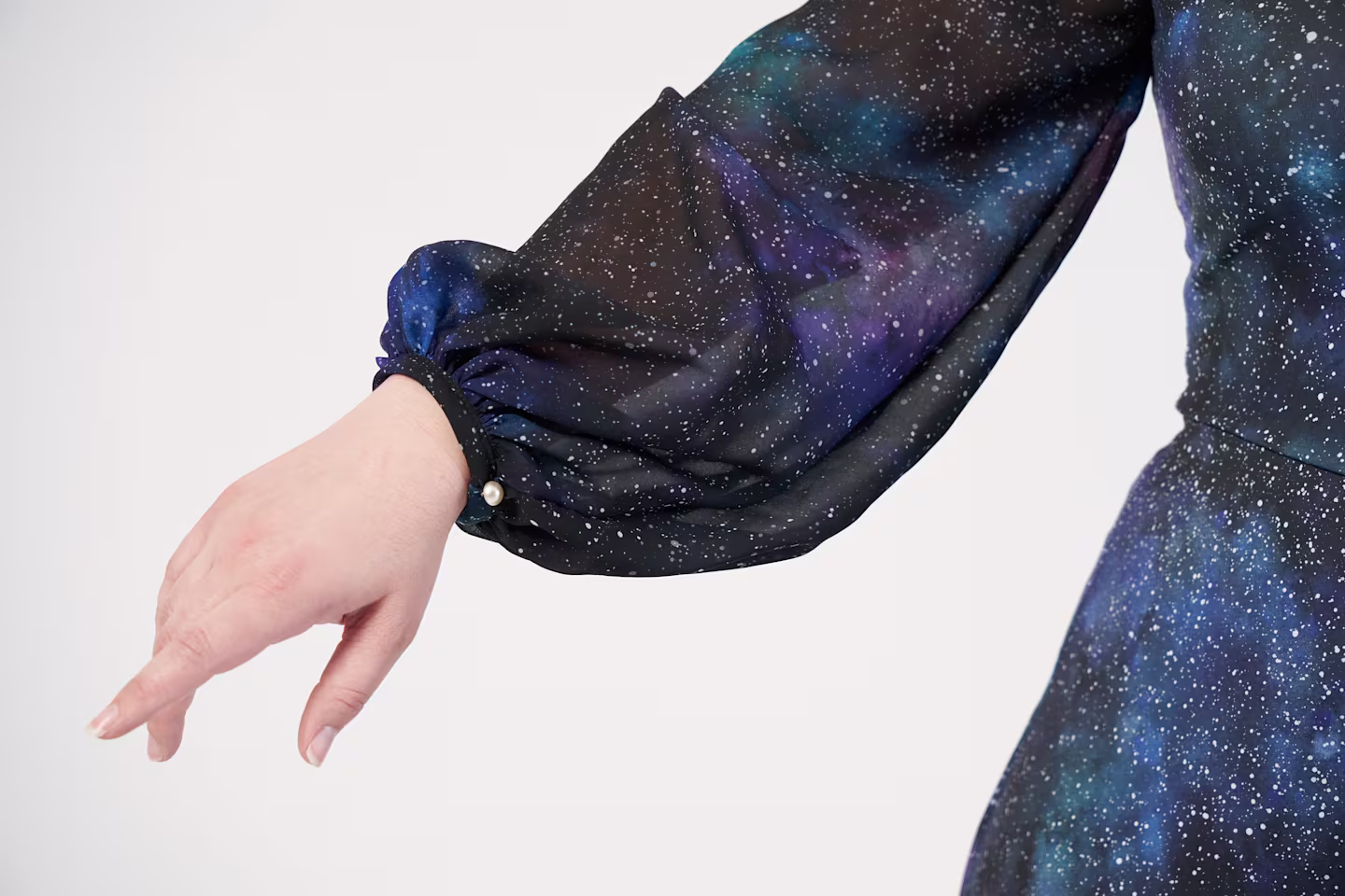 A dress in a galaxy print made with chiffon