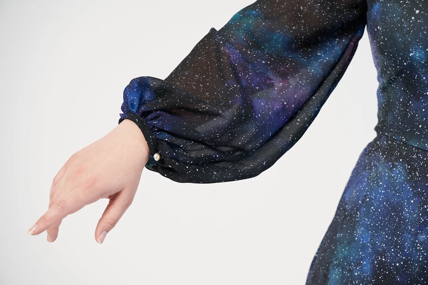 A dress in a galaxy print made with chiffon