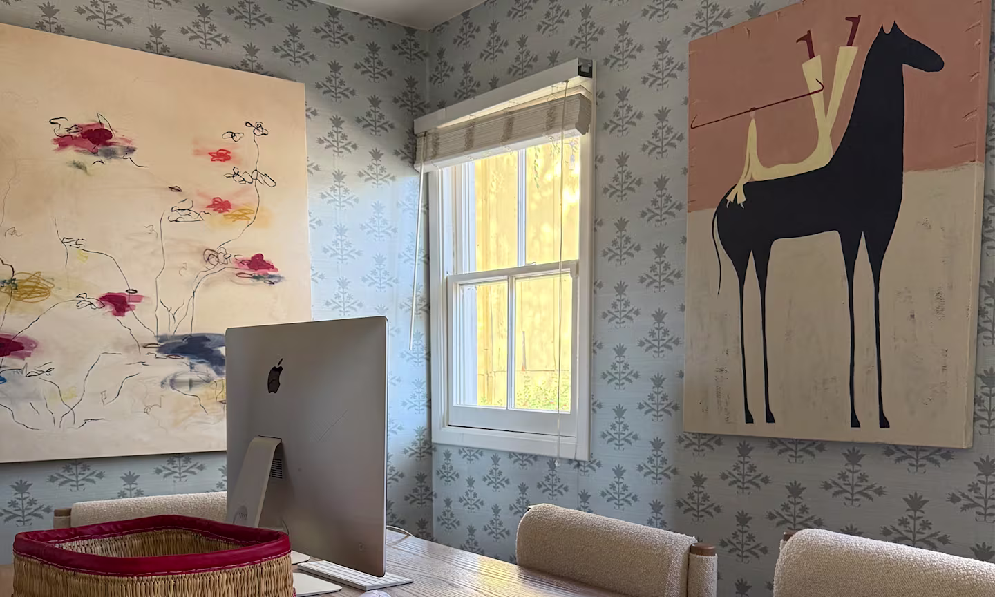 Office space with sage blue floral block printed wallpaper.