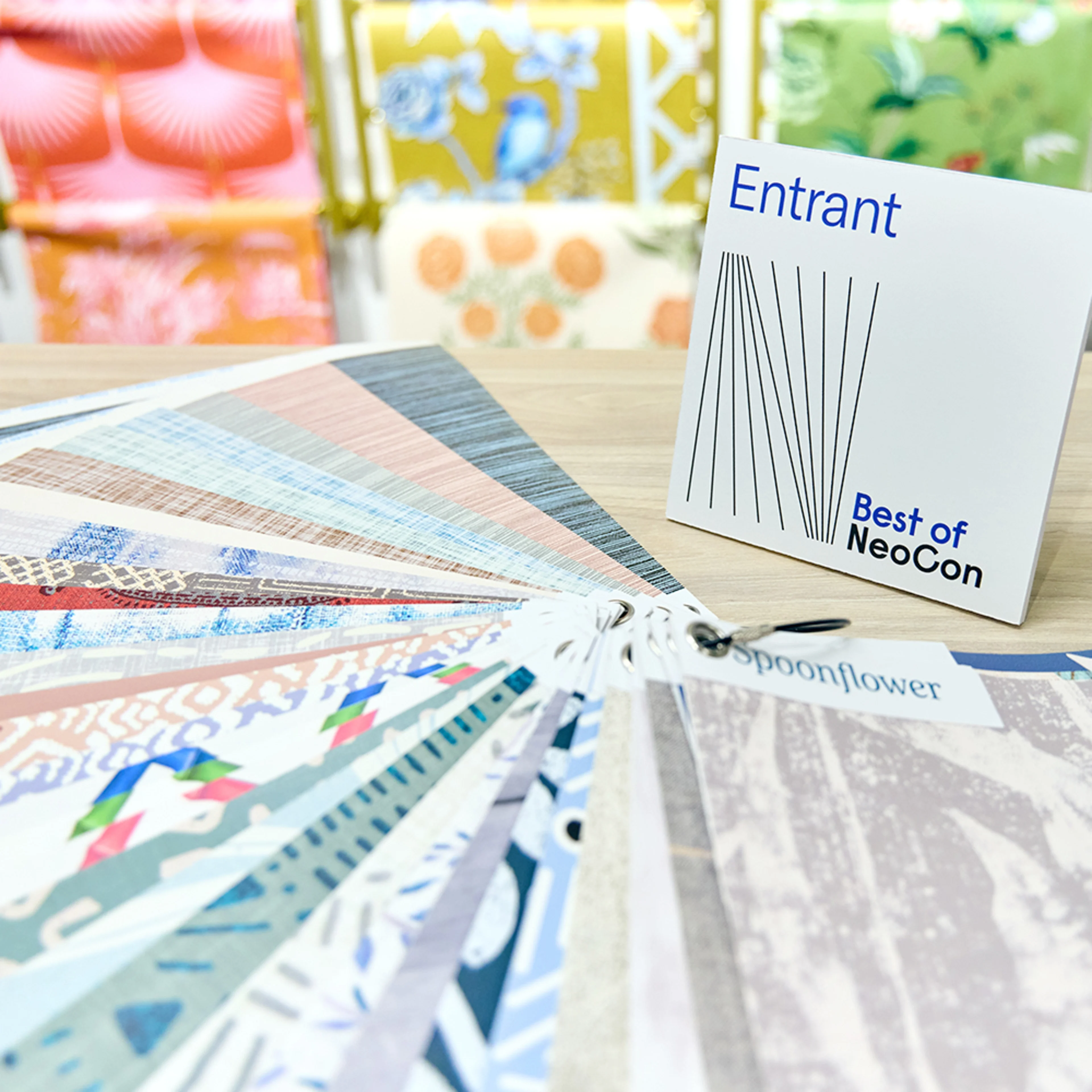 Spoonflower wallpaper samples on a table at NeoCon 2025.