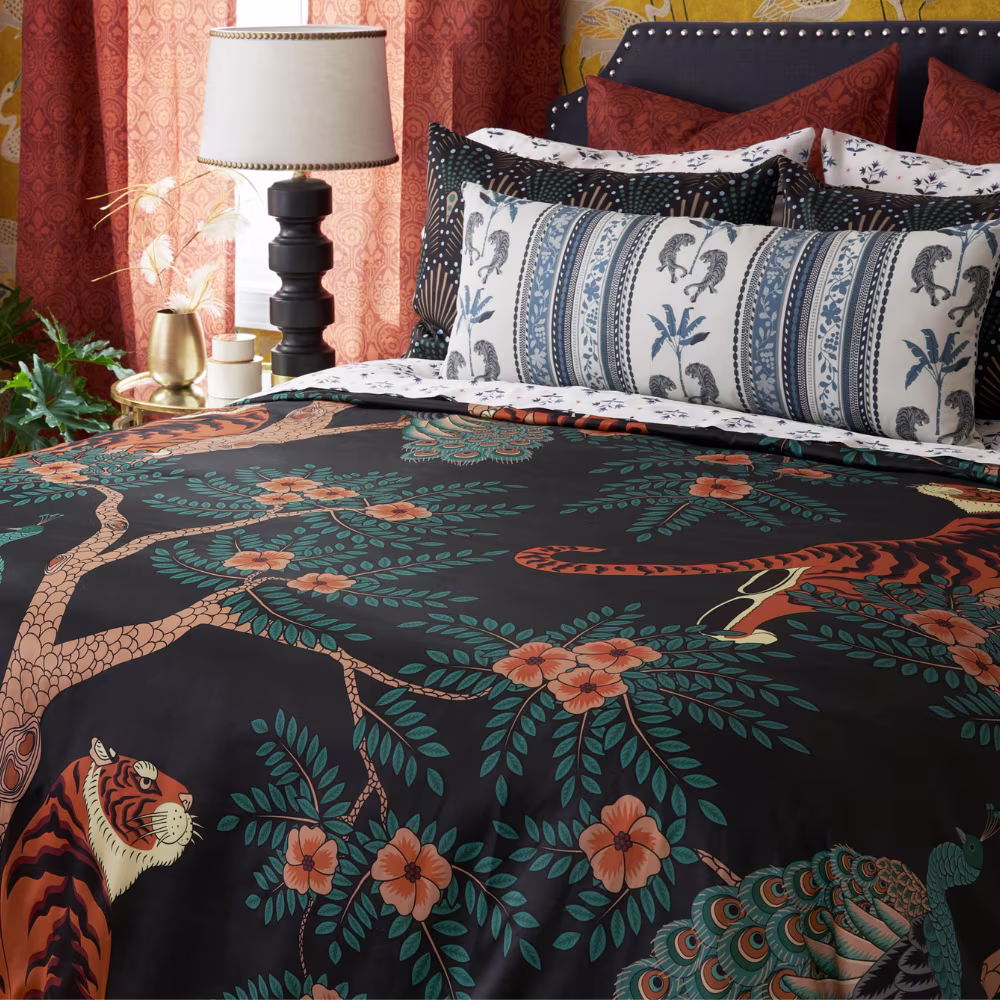 Dramatic bedroom with large-scale tiger print duvet cover