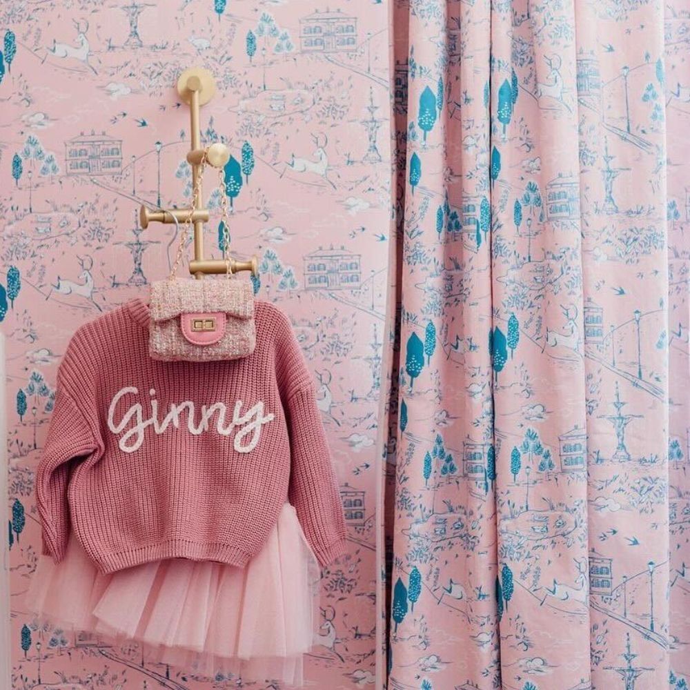 Nursery with blue and pink toile wallpaper