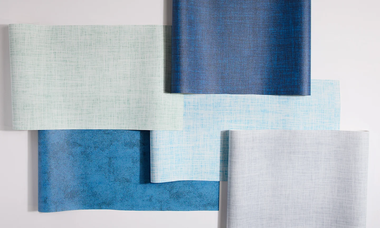 Solid but textured swatches of vinyl wallpaper.