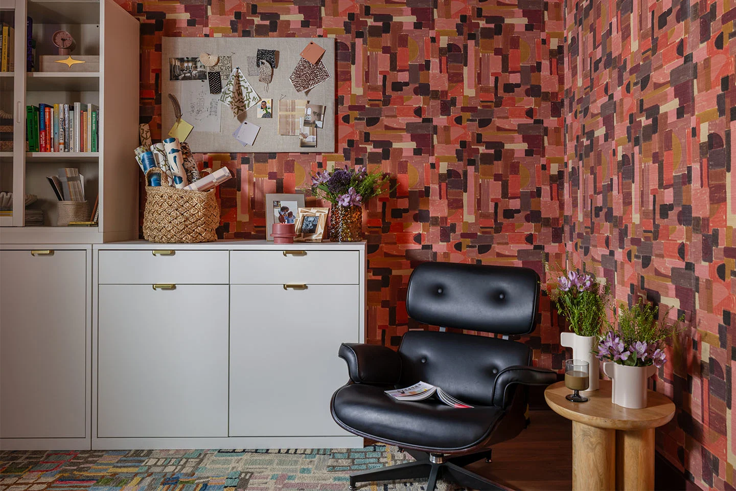 Modern office with warm-toned geometric abstract wallpaper.