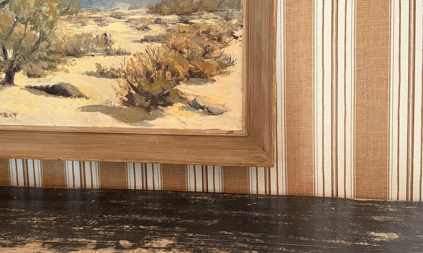 Close up of tan and cream striped pre-pasted wallpaper.