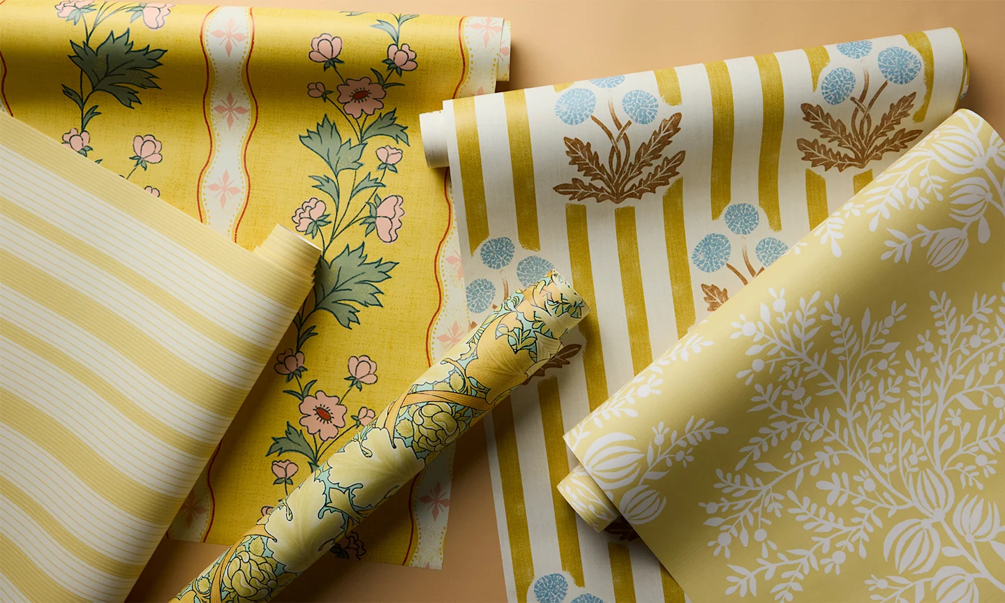 Rolls of warm yellow wallpaper.