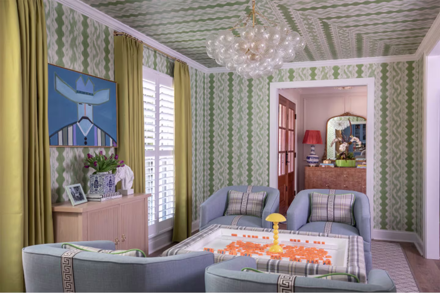 Living room with green striped wallpaper on ceiling and walls.