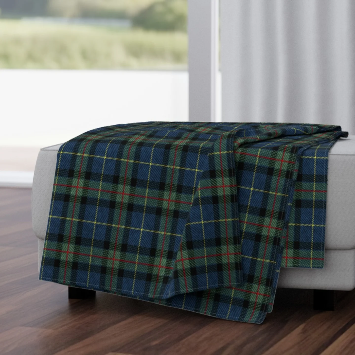 A blue and green tartan throw blanket