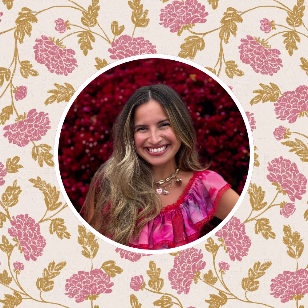 A headshot of Alissah Ashton in front of a favorite pink floral design by atlas_greene