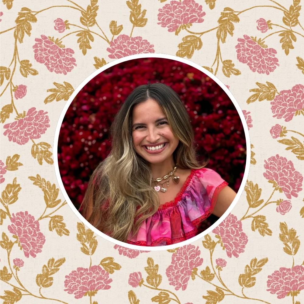 A headshot of Alissah Ashton in front of a favorite pink floral design by atlas_greene
