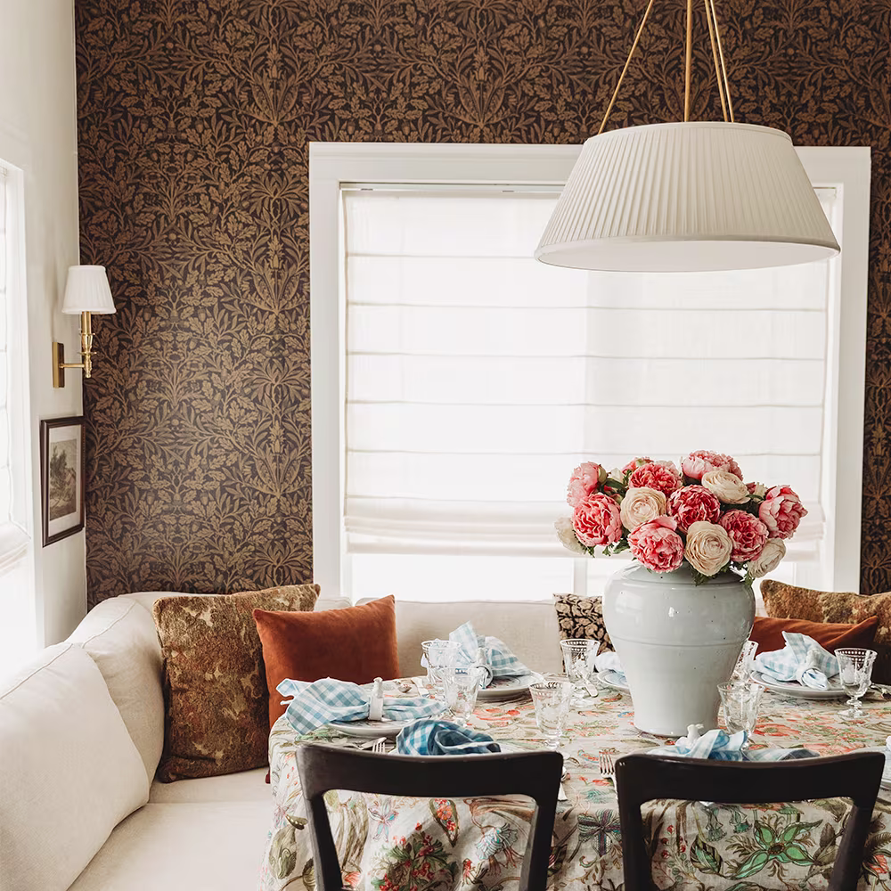Dining area with wallpaper in a dark acorn William Morris inspired design by Spoonflower artist salvagescapes. 