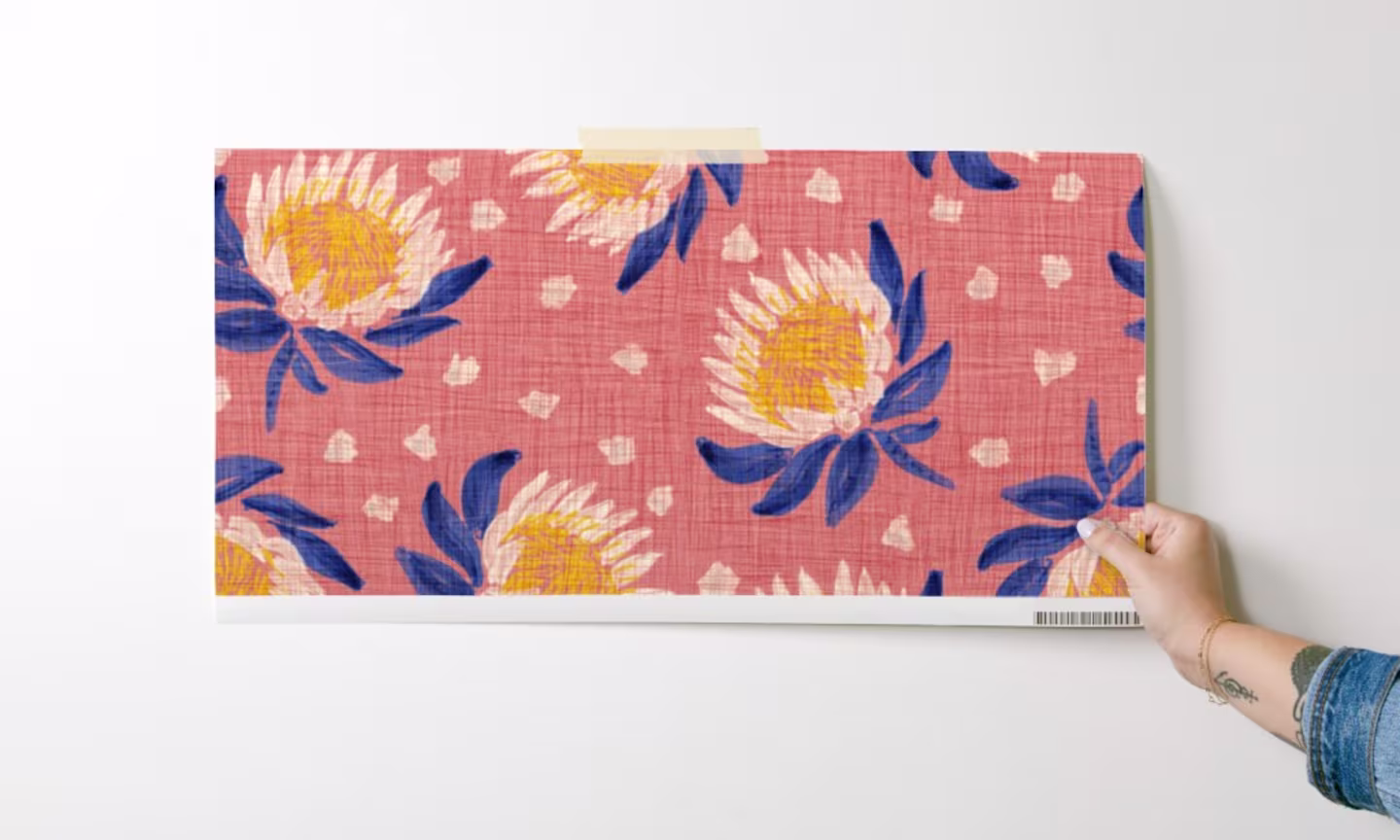 Woman holding wallpaper sample
