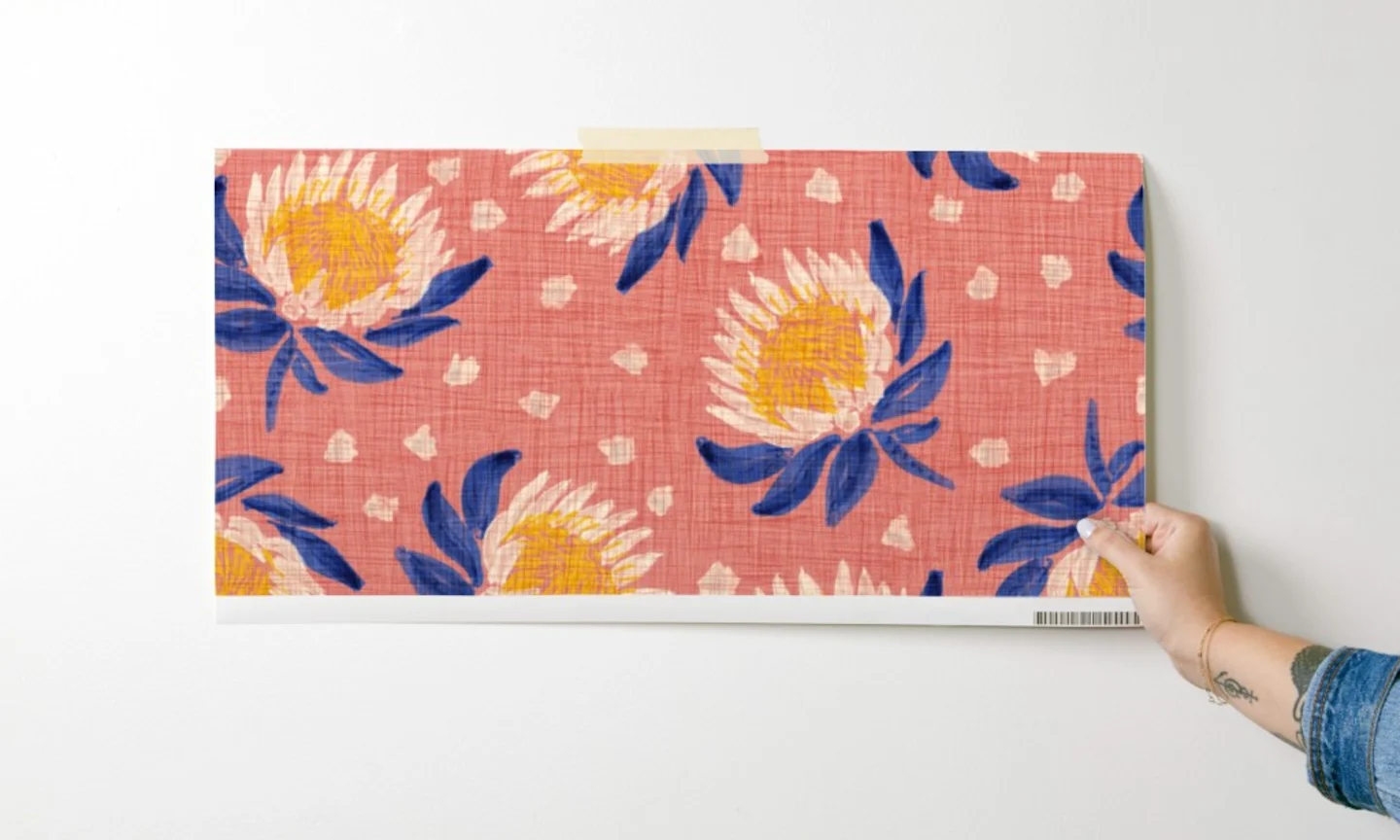 Woman holding wallpaper sample