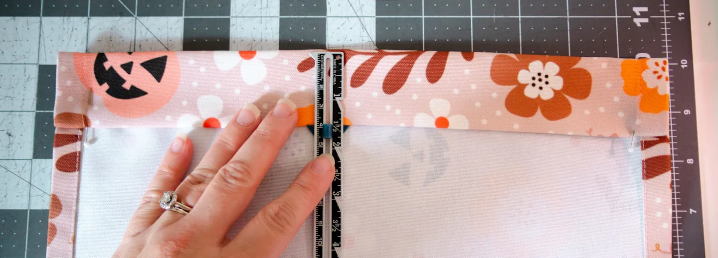 Folding the casing down at the top of the garden flag