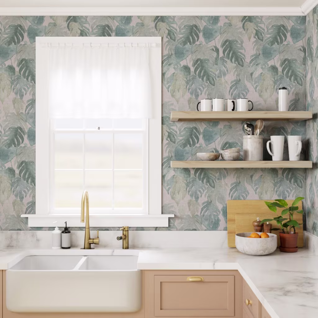 Kitchen with wallpaper in a textured monstera print.