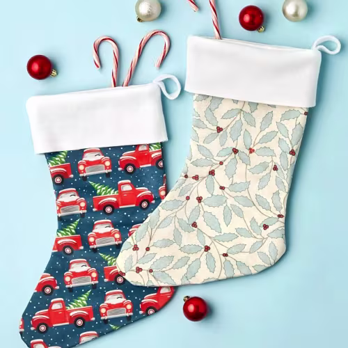 Two stockings made of Christmas-themed fabric