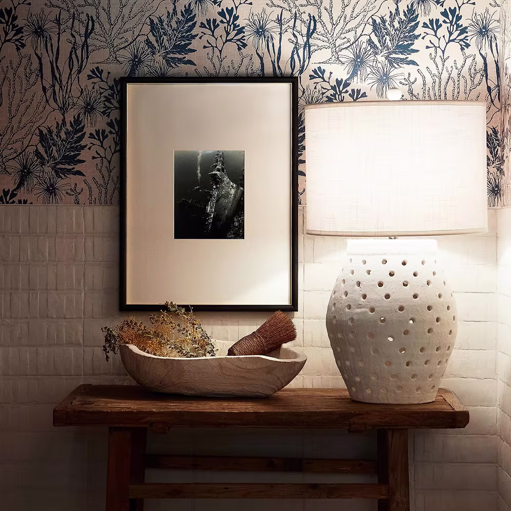 Blue and cream coral wallpaper in a bathroom space.