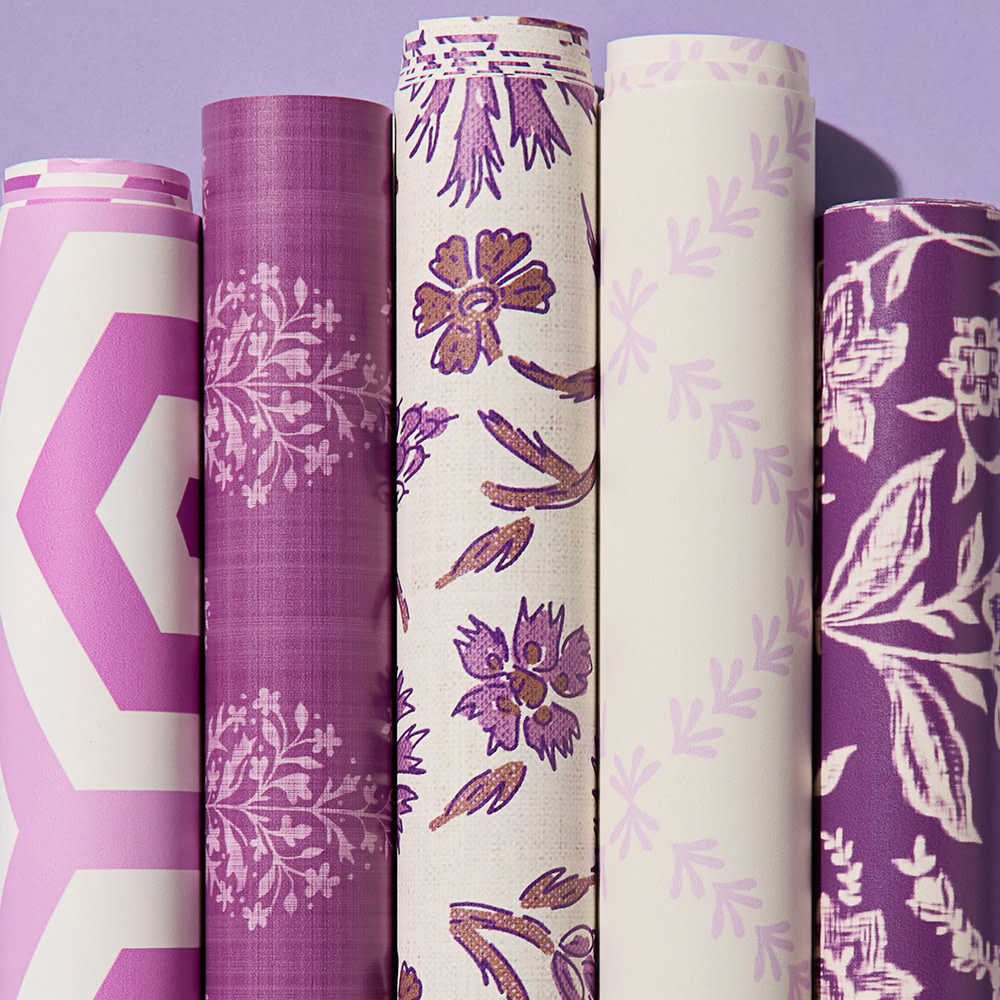 Rolls of purple wallpaper.