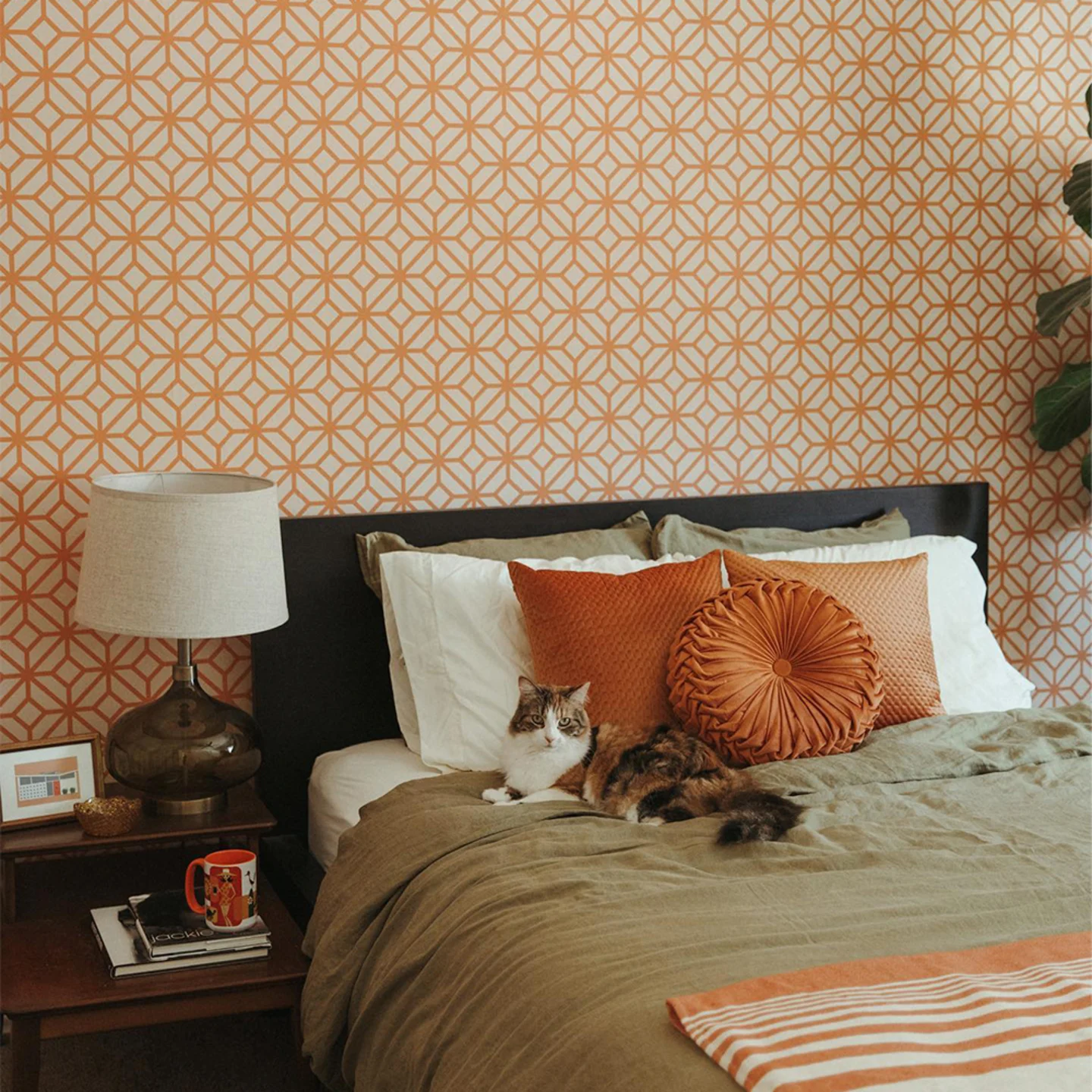 bedroom with orange geometric wallpaper