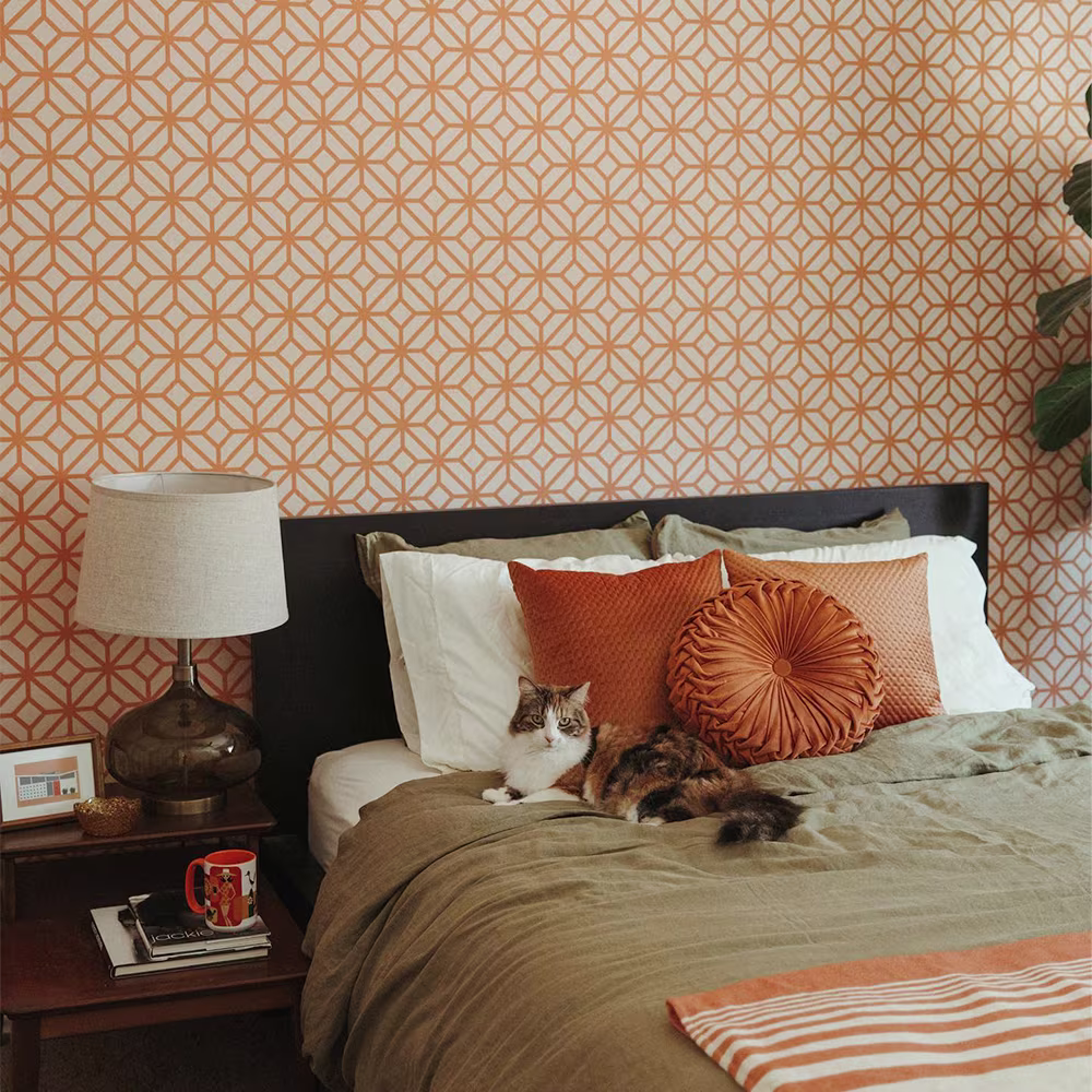 bedroom with orange geometric wallpaper