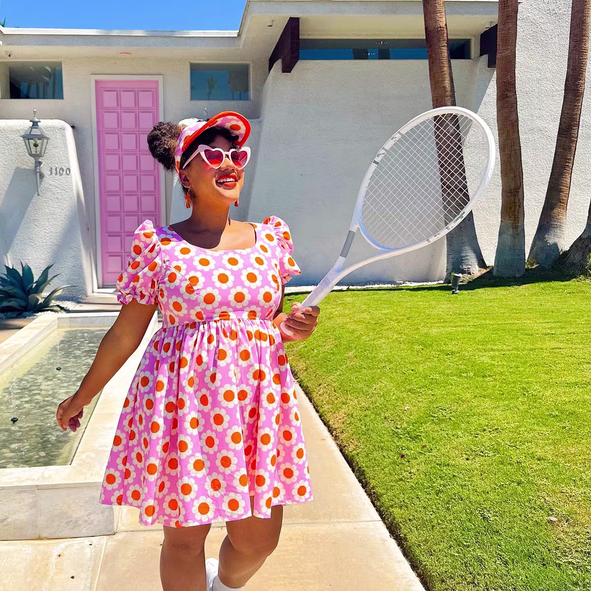 Color Me Courtney in a bright floral sport stretch woven tennis dress
