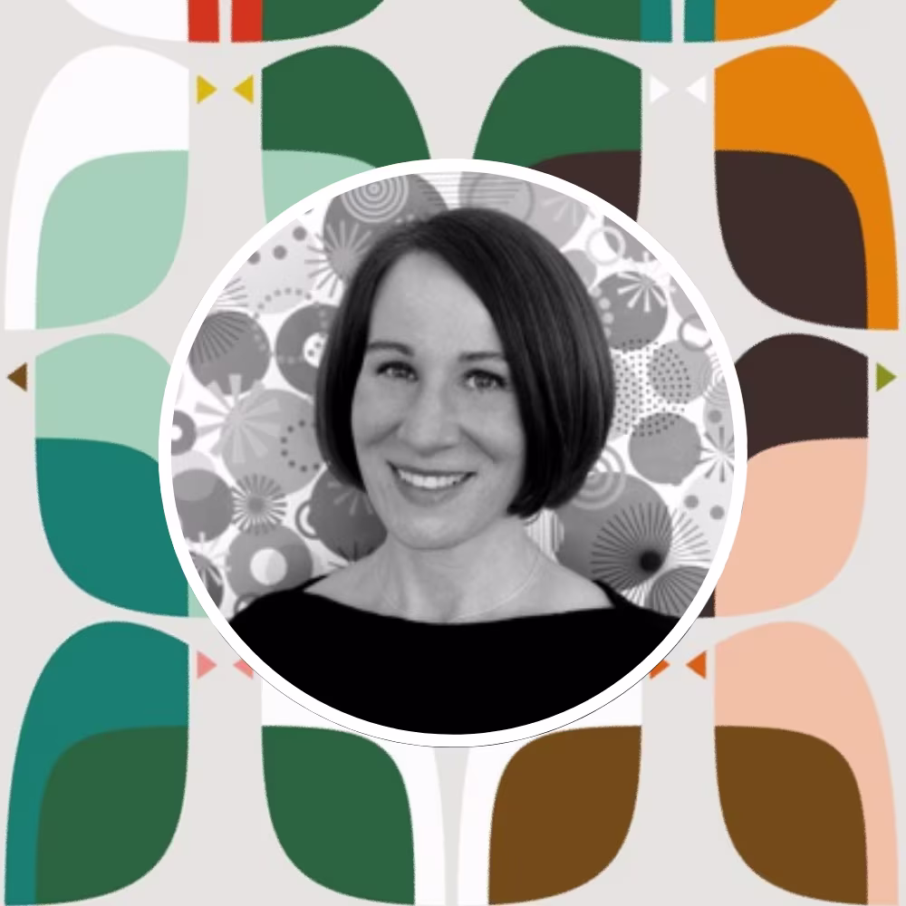 Head shot of Spoonflower artist Kate Rhees in front of one of her designs.