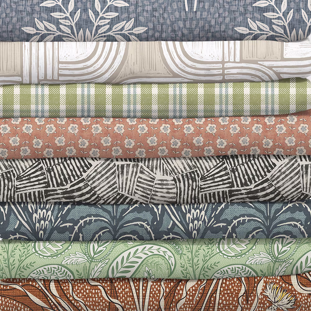 Stack of fabrics from the custom cozy collection.