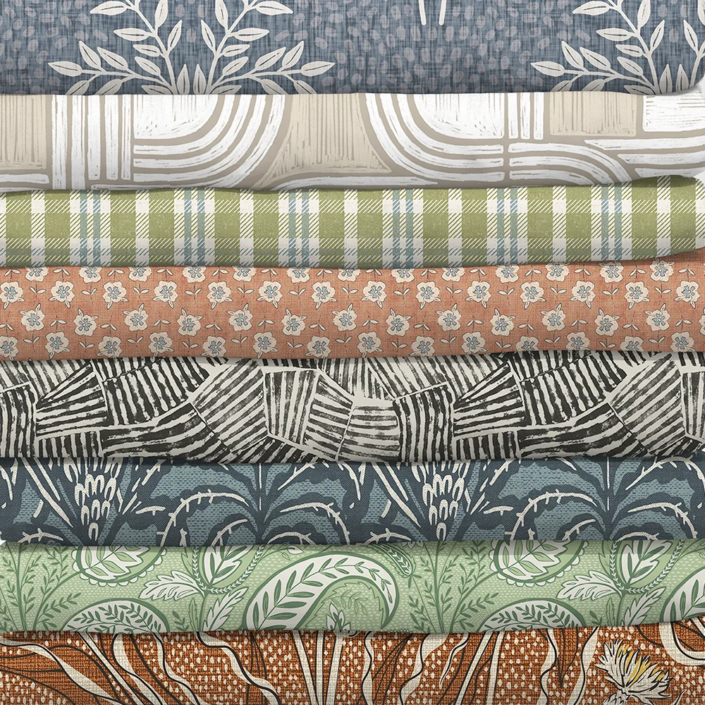 Stack of fabrics from the custom cozy collection.