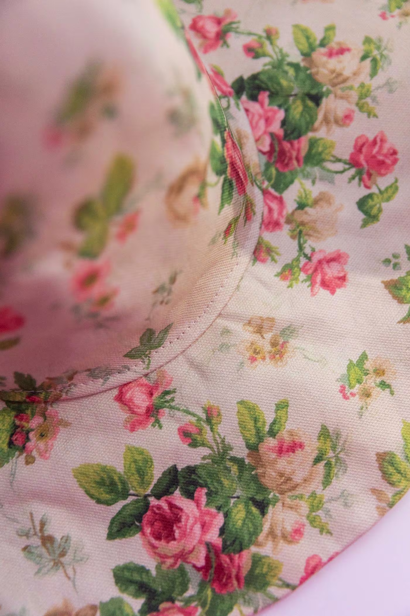 From an angle, we see the completed witch hat. The stitches that connect the cone to the brim are in focus.