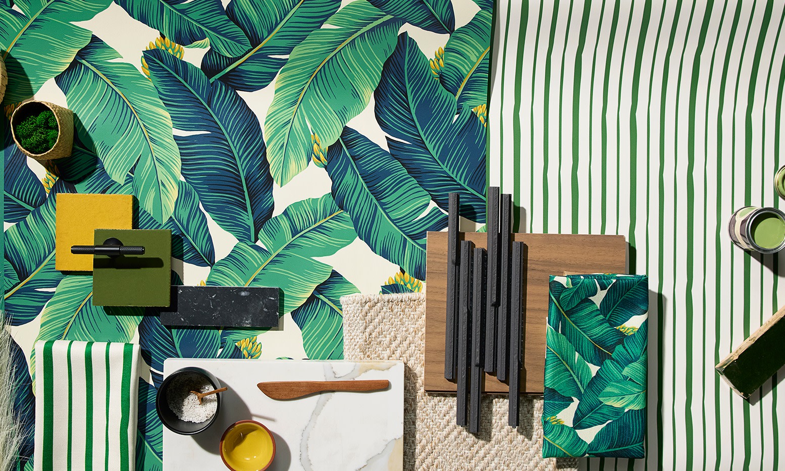 Rolls of green wallpaper in a green background.